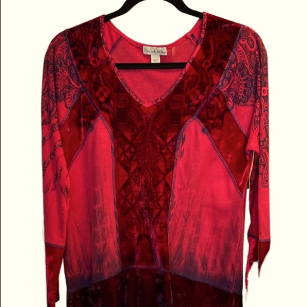 Woman’s 2piece top set.  Red velvet fibers are polyester.  The coat has a hood.
